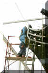 Making a start removing the disintergrating figurehead